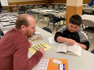 Bible Adventure student and Listener reading Bible